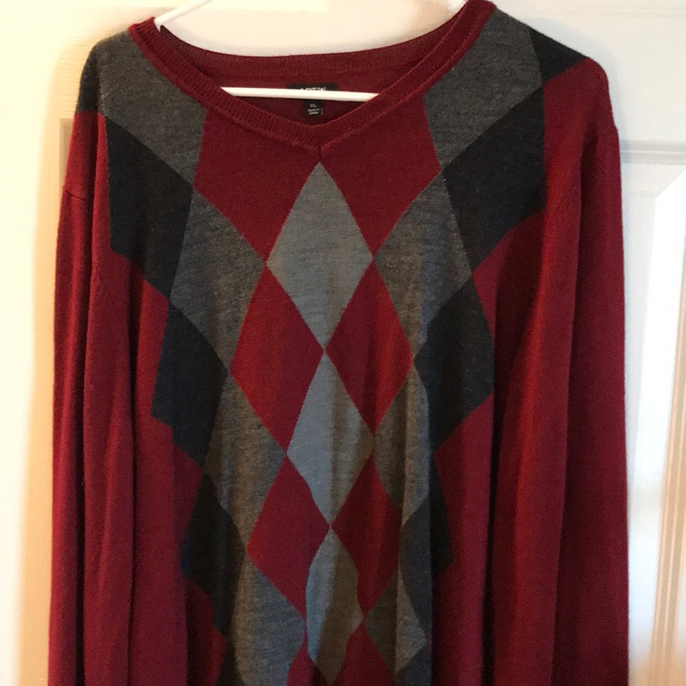 Maroon, gray, and black sweater.